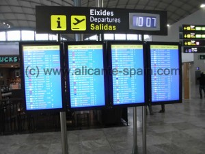 Monitors at the inner departure area of Alicante airport showing the boarding gates number of each flight